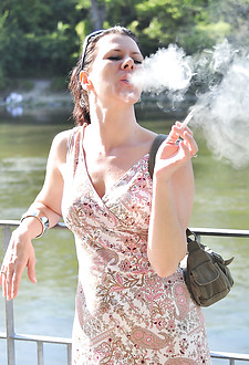 Sexy smoking MILF Mina smokes in public.