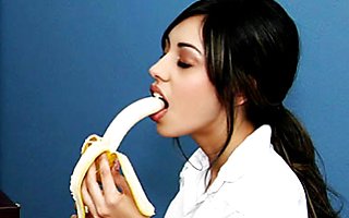 sexy brunette girl seduces her teacher by eating banana before getting fucked.
