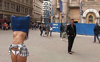 Girl is bound in the streets with her shirt over her head and her tits exposed!