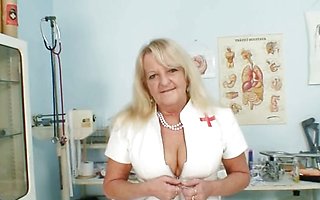 Grandma in uniform spreads blond hairy pussy