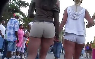 Tight shorts girls are walking in front of me deliciously waving the incredible butts