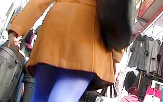 Butt in blue tights up the coat
